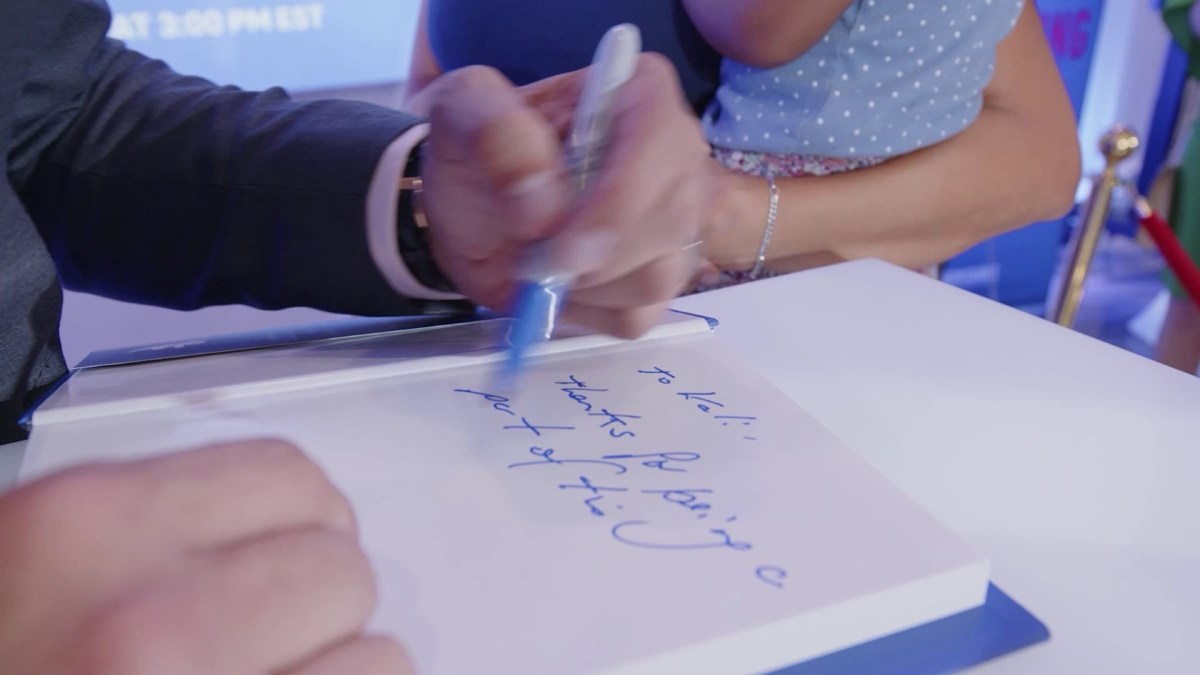 Manuel signing a copy of Marketing Magic