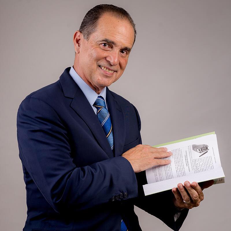 frank suarez holding a book