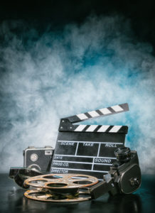 Retro film production accessories still life. Concept of filmmaking. Smoke effect on background