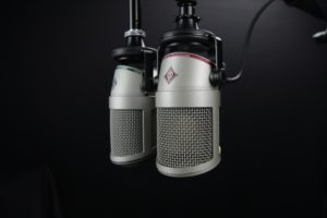 microphone condenser with black background and mic holder